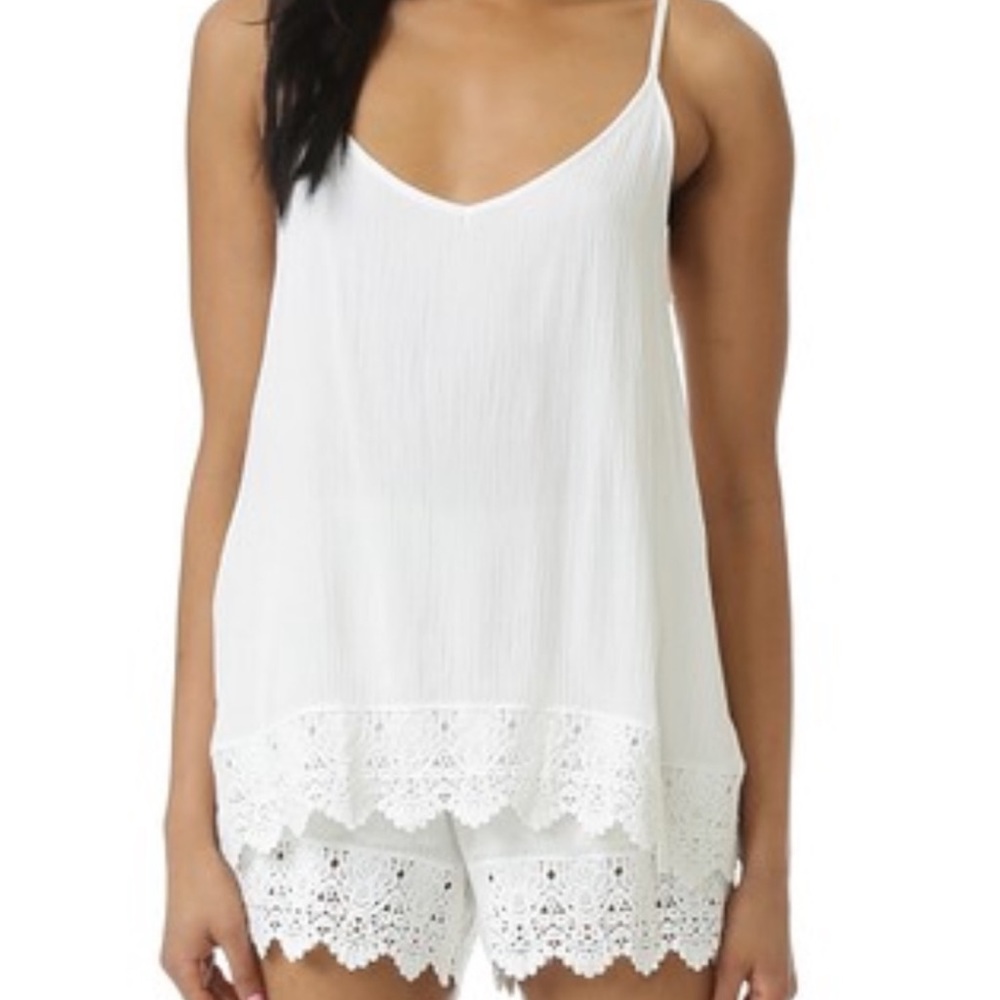 White, chic, lacy detailed romper.
